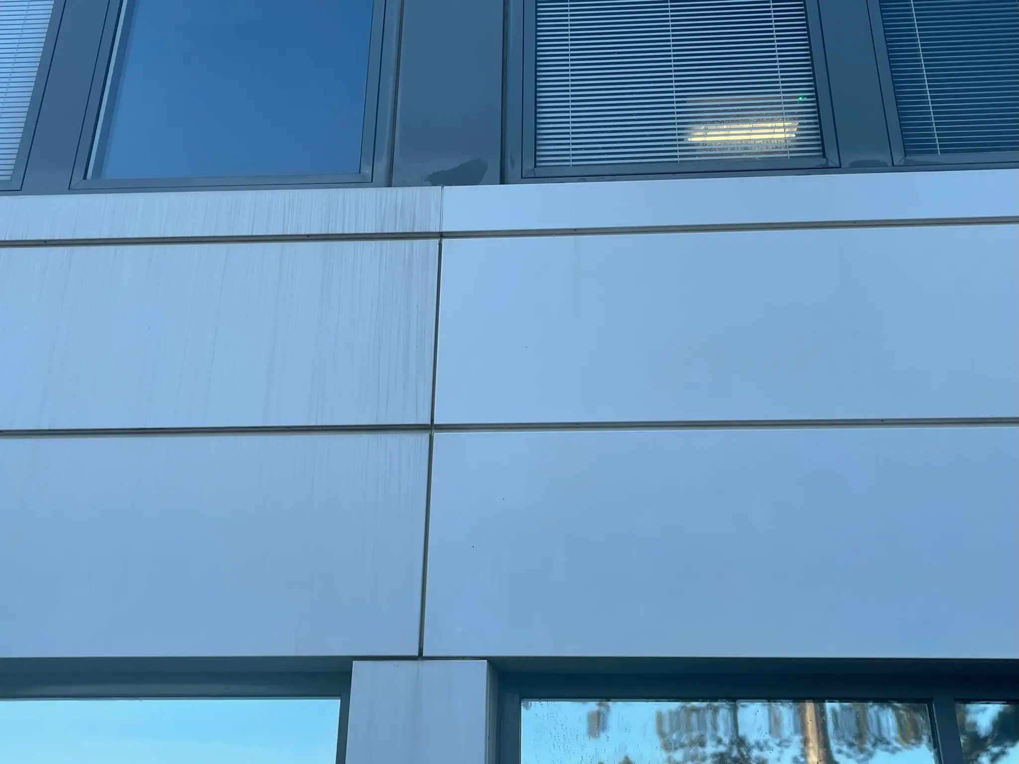 DMC Facilities Management operative performing restorative cleaning on commercial building