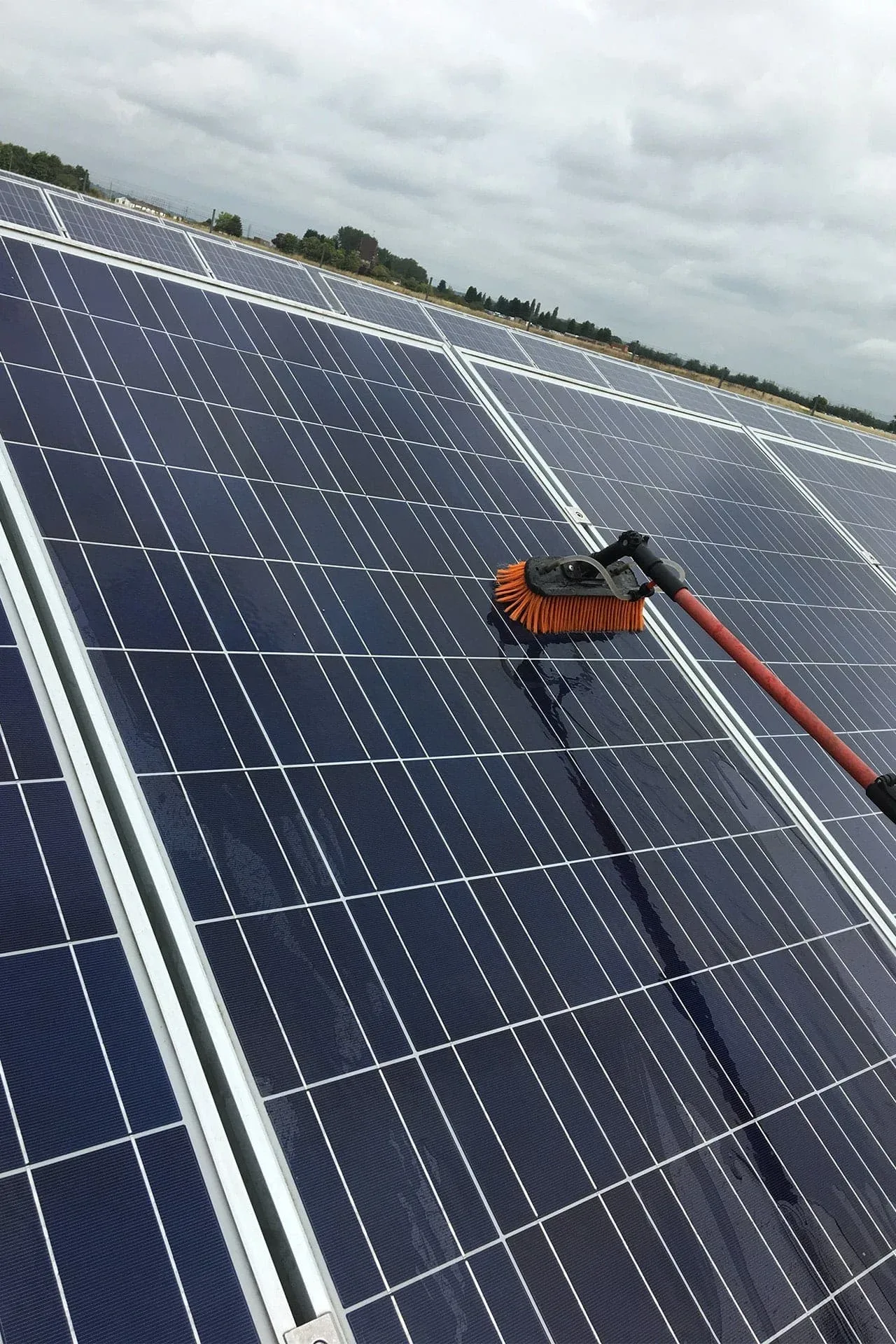 Commercial solar panel cleaning on a large rooftop array